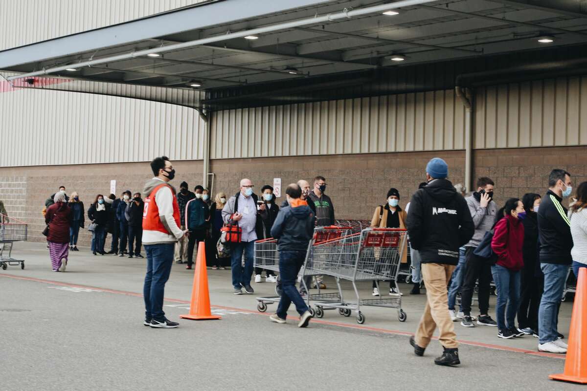 Hundreds of people lined up outside Costco on November 15, 2020 after Gov. Jay Inslee announced new strict COVID-19 restrictions.