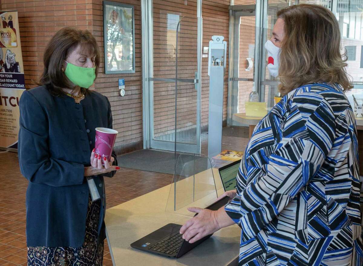 Kellie Spencer, right, MISD Chief Operating Officer, shows MISD interim Superintendent Ann Dixon the list of classes that still need substitutes 11/16/2020 morning as MISD administration personnel sign up to sub in classrooms. Tim Fischer/Reporter-Telegram