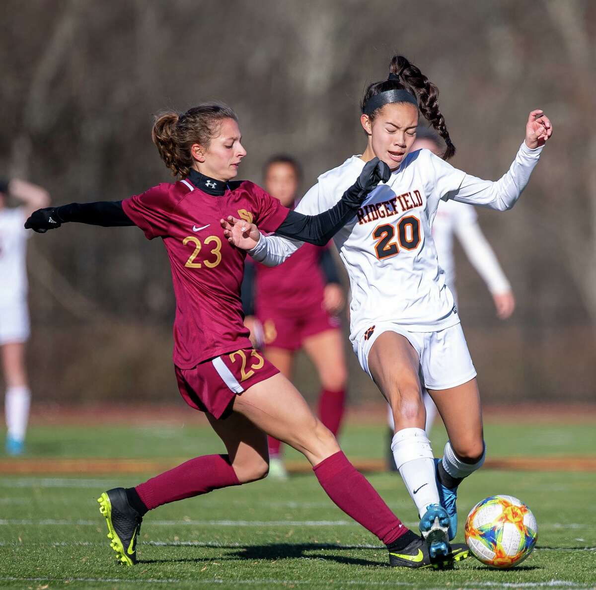 Julia Bragg (right) and the unbeaten Ridgefield girls soccer team have been named co-champs of the FCIAC Central Region.