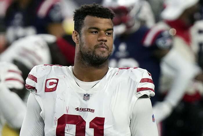 San Francisco 49ers safety Tarvarius Moore, left, and linebacker