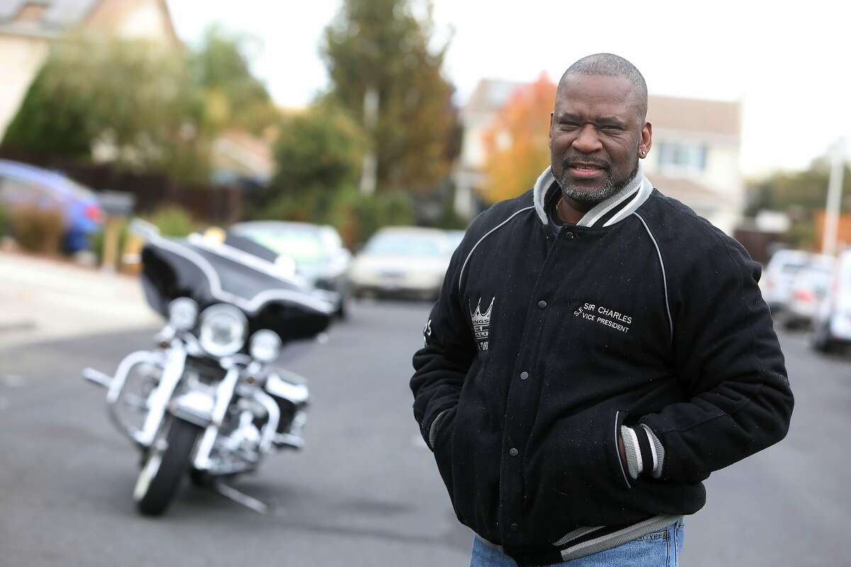 Charles Canady, who goes by the nickname Sir Chars, stands for a portrait with his Harley Davidson motorcyle on Friday, November 13, 2020 in Antioch, CA. Canady, who goes by the nickname Sir Chars, leads a Thanksgiving morning run of the Kings of Cali, a Black motorcycle club in the East Bay, to GLIDE Church where they have served Thanksgiving dinner for 16 years. This year GLIDE will serve Thanksgiving dinner for 2,300 needy diners in three tents on Ellis Street.