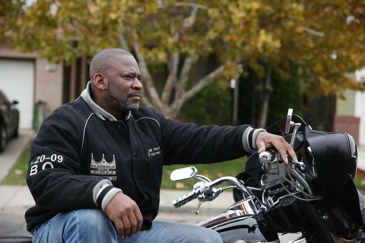 Charles Canady, who goes by the nickname Sir Chars, sits for a portrait with his Harley Davidson motorcyle on Friday, November 13, 2020 in Antioch, CA. Canady, who goes by the nickname Sir Chars, leads a Thanksgiving morning run of the Kings of Cali, a Black motorcycle club in the East Bay, to GLIDE Church where they have served Thanksgiving dinner for 16 years. This year GLIDE will serve Thanksgiving dinner for 2,300 needy diners in three tents on Ellis Street.