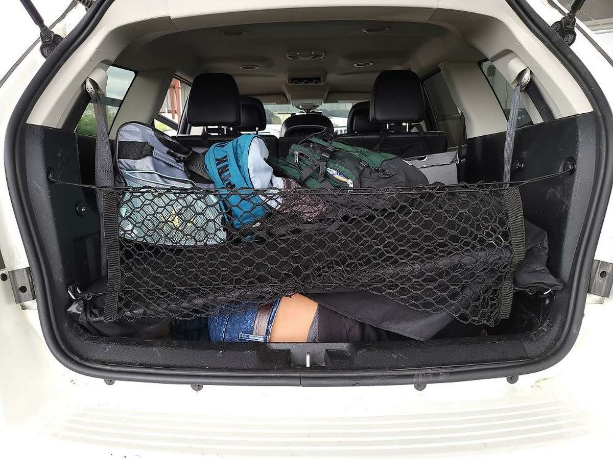 An individual can be seen in the cargo area of this sport utility vehicle. U.S. Border Patrol agents said they found three people inside the cargo area. All were immigrants who were in the country illegally.