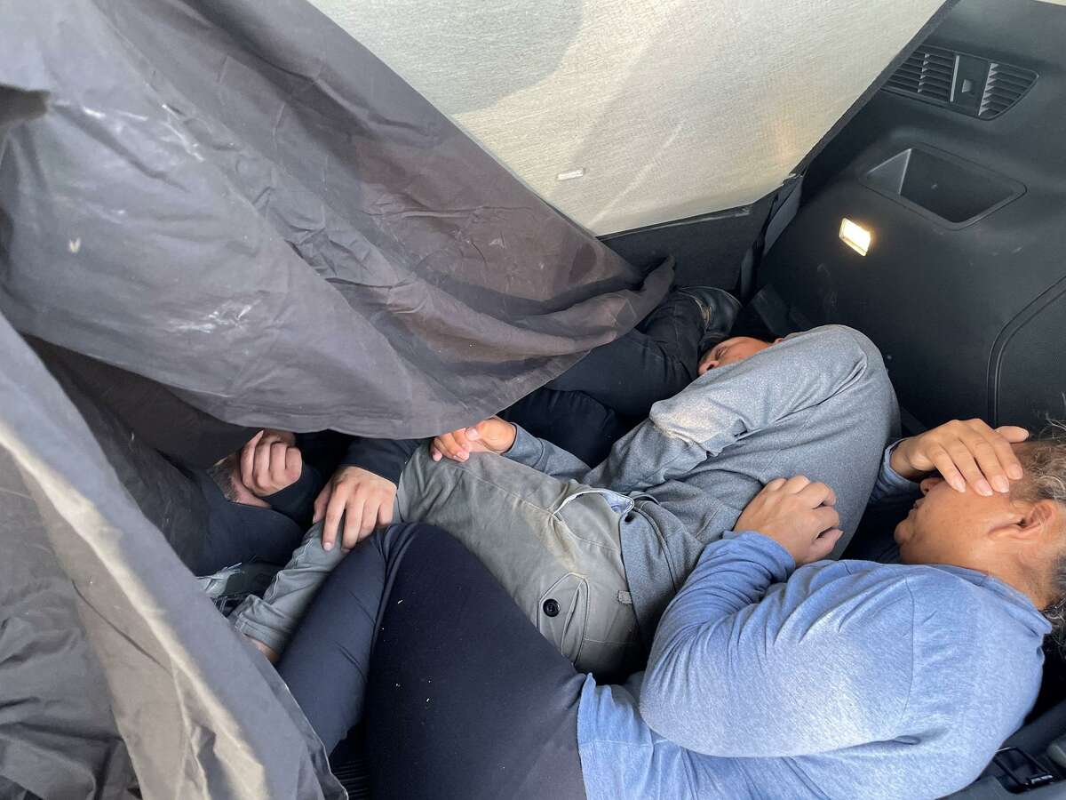 Three people can be seen inside the cargo area of this sport utility vehicle. U.S. Border Patrol agents determined that all were immigrants who had crossed the border illegally.