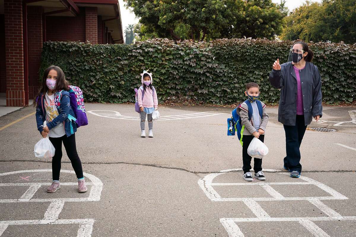 Kindergartners wait to be picked up after a morning session at Brock Elliott Elementary in Manteca, San Joaquin County.