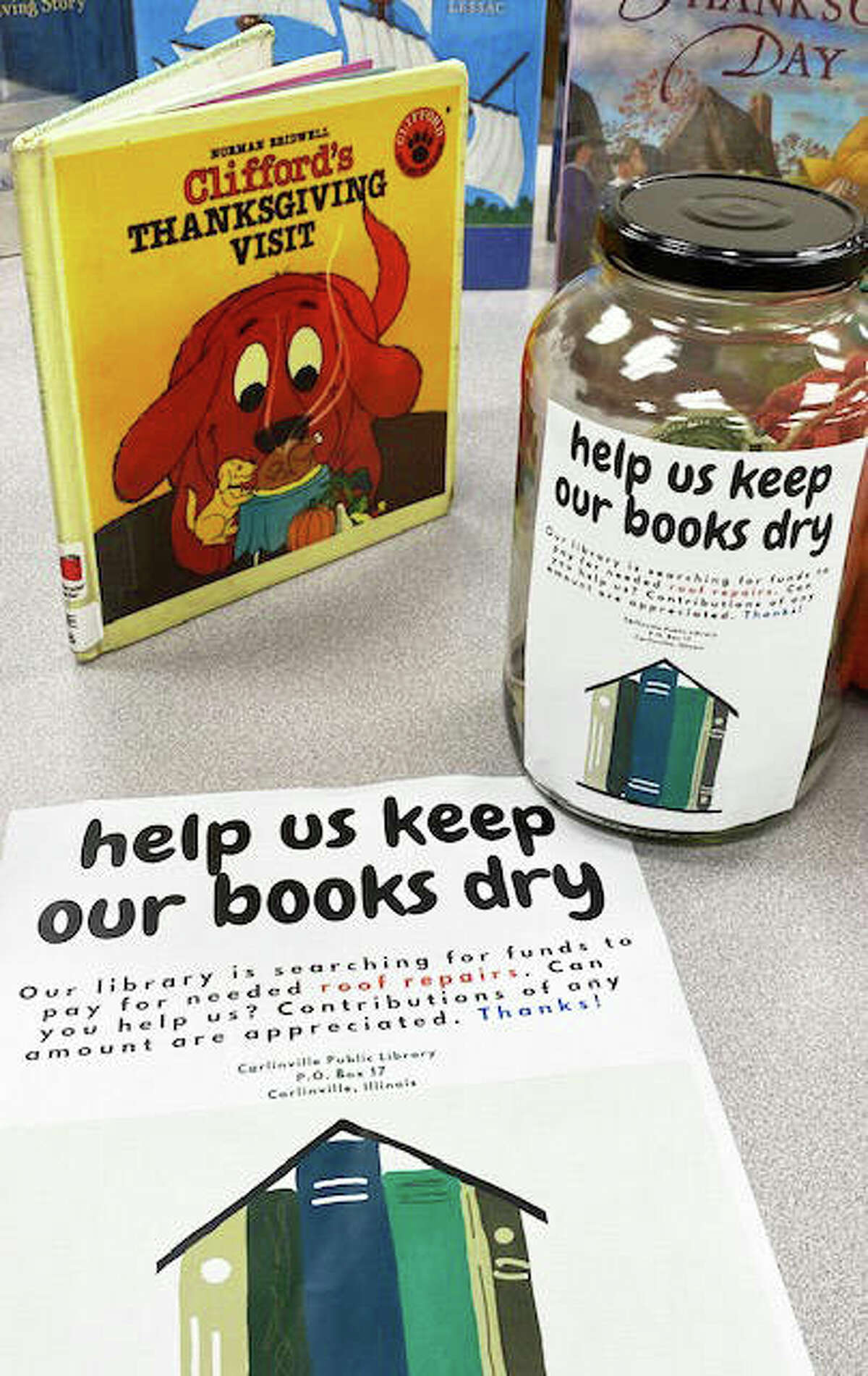 “Help Us Keep Our Books Dry” is a theme in the Carlinville Public Library’s drive to seek funding to offset the cost of a new roof. The library’s share of the cost of the roof could be as high as $80,000, and could affect the library’s budget for years to come. A GoFundMe page has also been set up for donations to the project, and residents are also invited the GoFundMe link on social media.