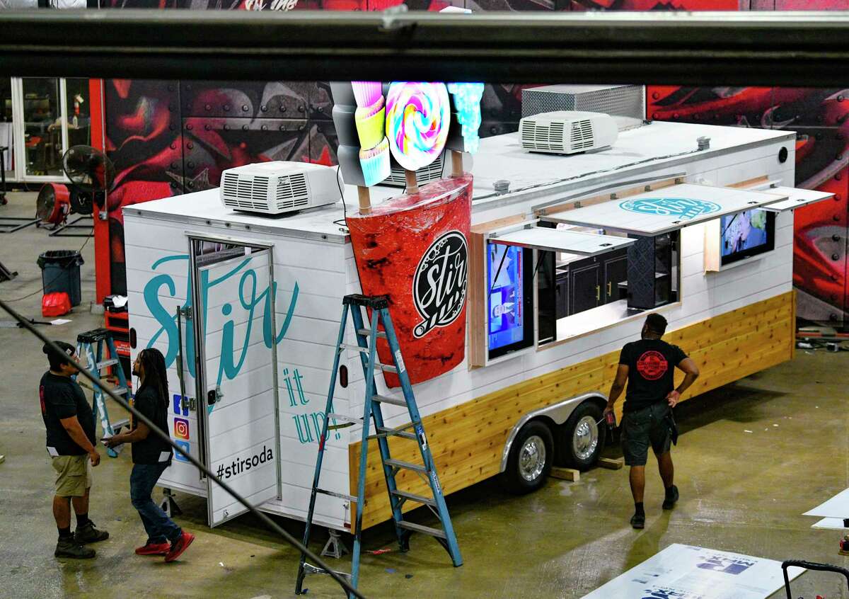 A crew at Cruising Kitchens works on the Stir Soda food truck. Operating under the radar, the company works with everyone from mom-and-pop operators to large companies like Whataburger and Raising Cane’s.