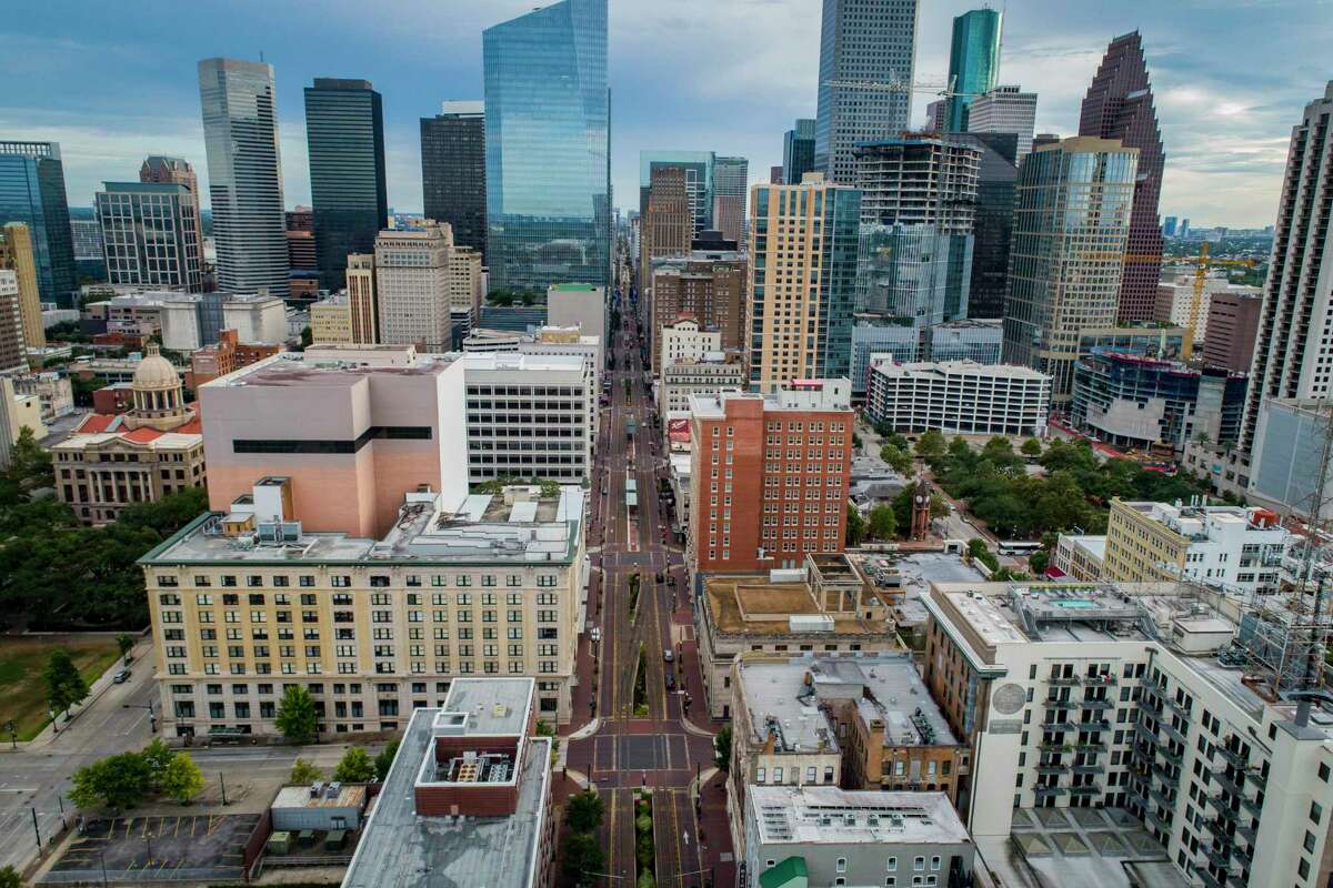 The Metro light rail line runs down Main Street on July 28, 2020, in downtown Houston. City Council on Nov. 18 approved a program to use Main Street for outdoor dining.