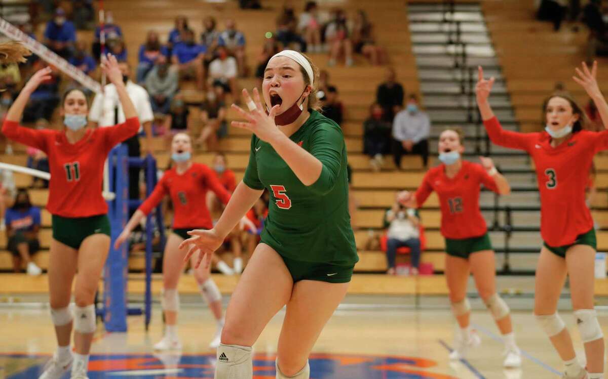 The Woodlands libero Jacqueline Lee (5) calls the ball out of bounds during the fifth set of a District 13-6A high school volleyball match at Grand Oaks High School, Tuesday, Oct. 20, 2020, in Spring.