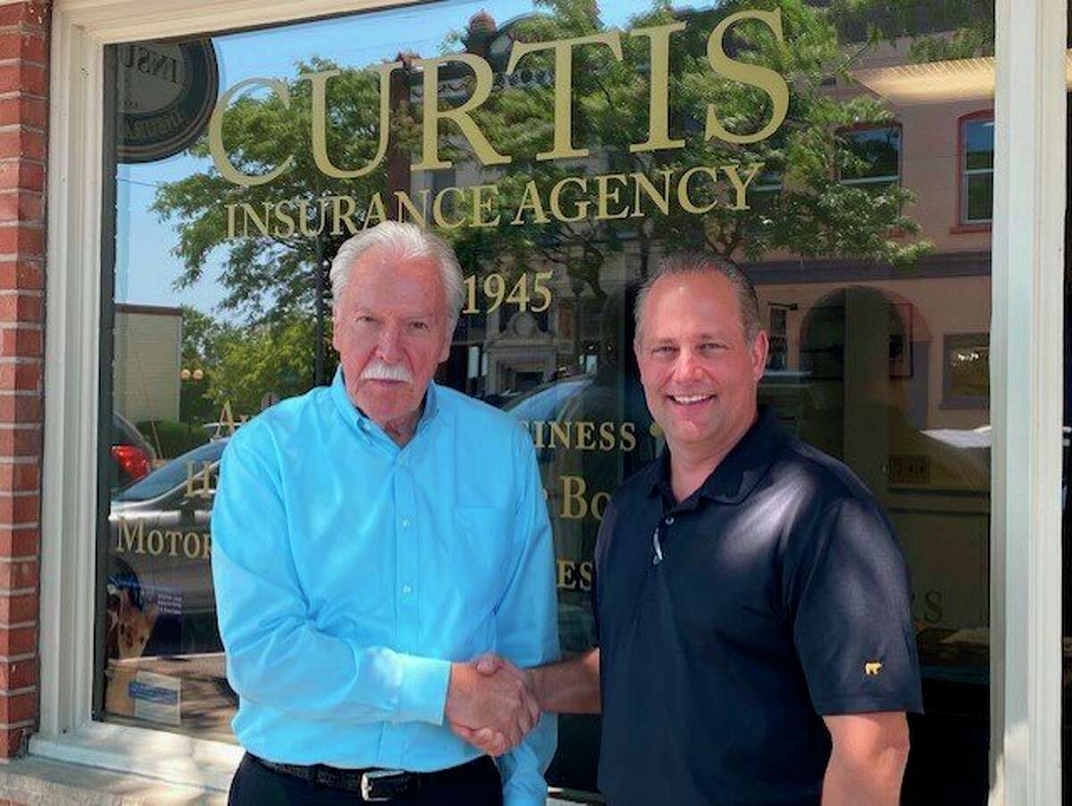 Don Smith, former owner of Curtis Insurance Agency, with new owner Steve Dalessandro. (Courtesy Photo)