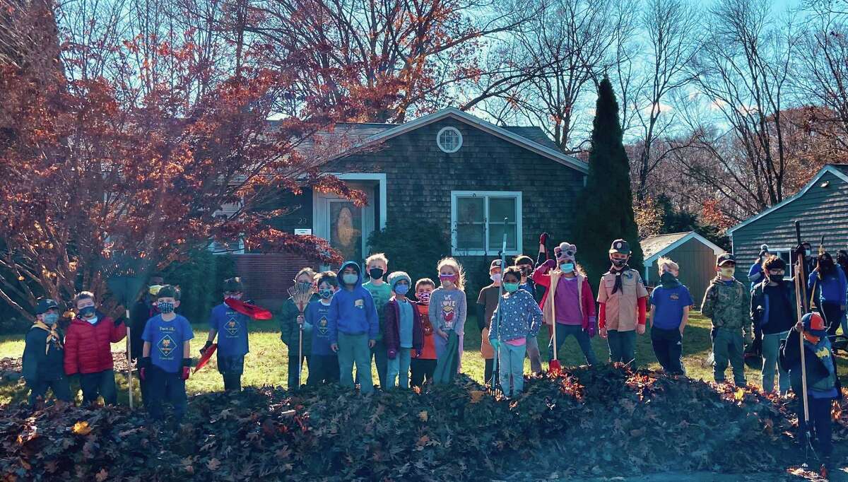 For the second consecutive year Cub Scout Pack 167 partnered with the Trumbull Rotary to help a Trumbull resident in need with cleaning their property for fall. The scouts raked leaves while being outdoors with their friends.