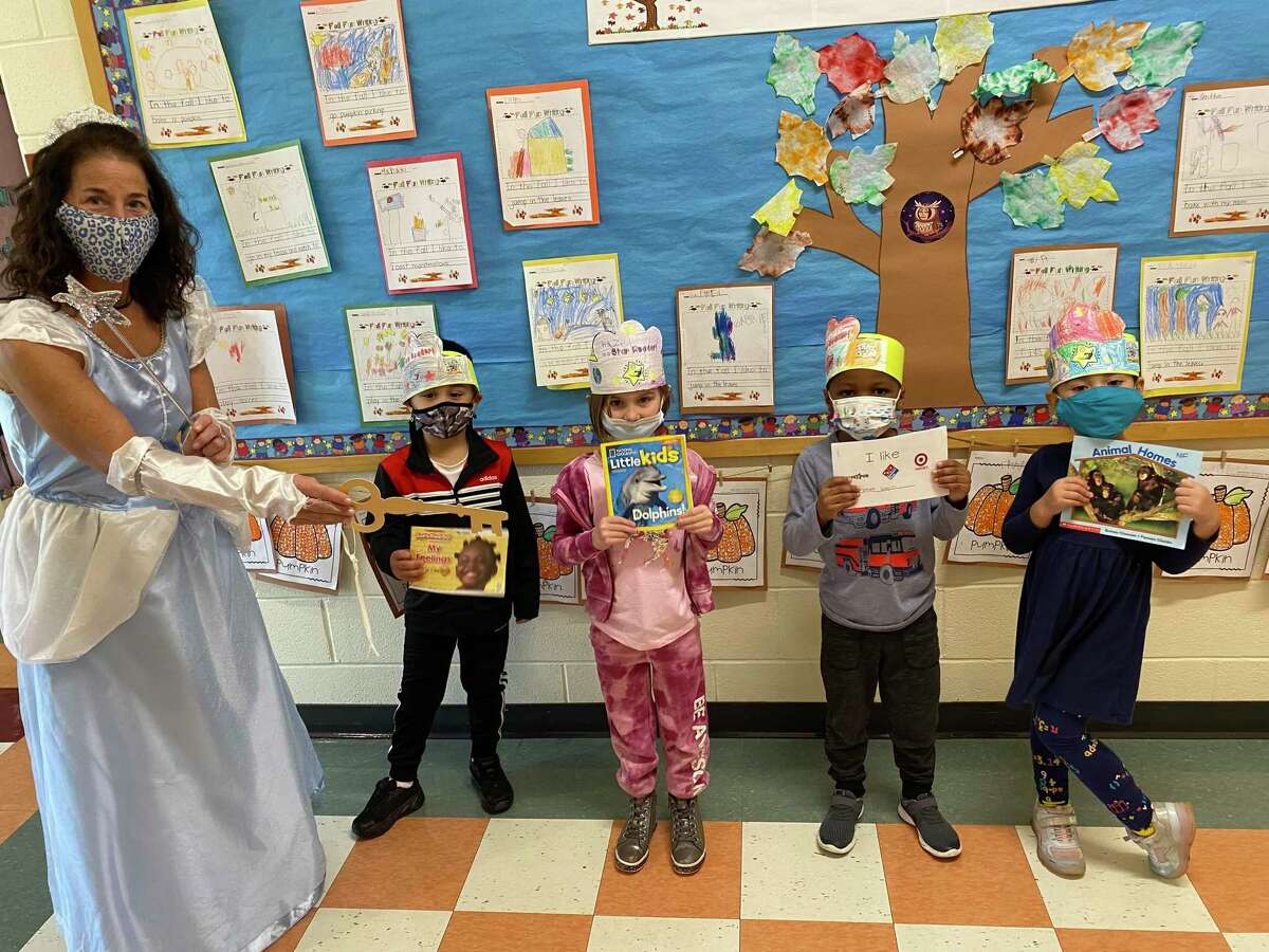 The kindergarten classes at Frenchtown Elementary School received the Key to the Reading Kingdom recently. Wearing a tiara, Principal Gina Prisco played the role of the Queen of the Reading Kingdom.