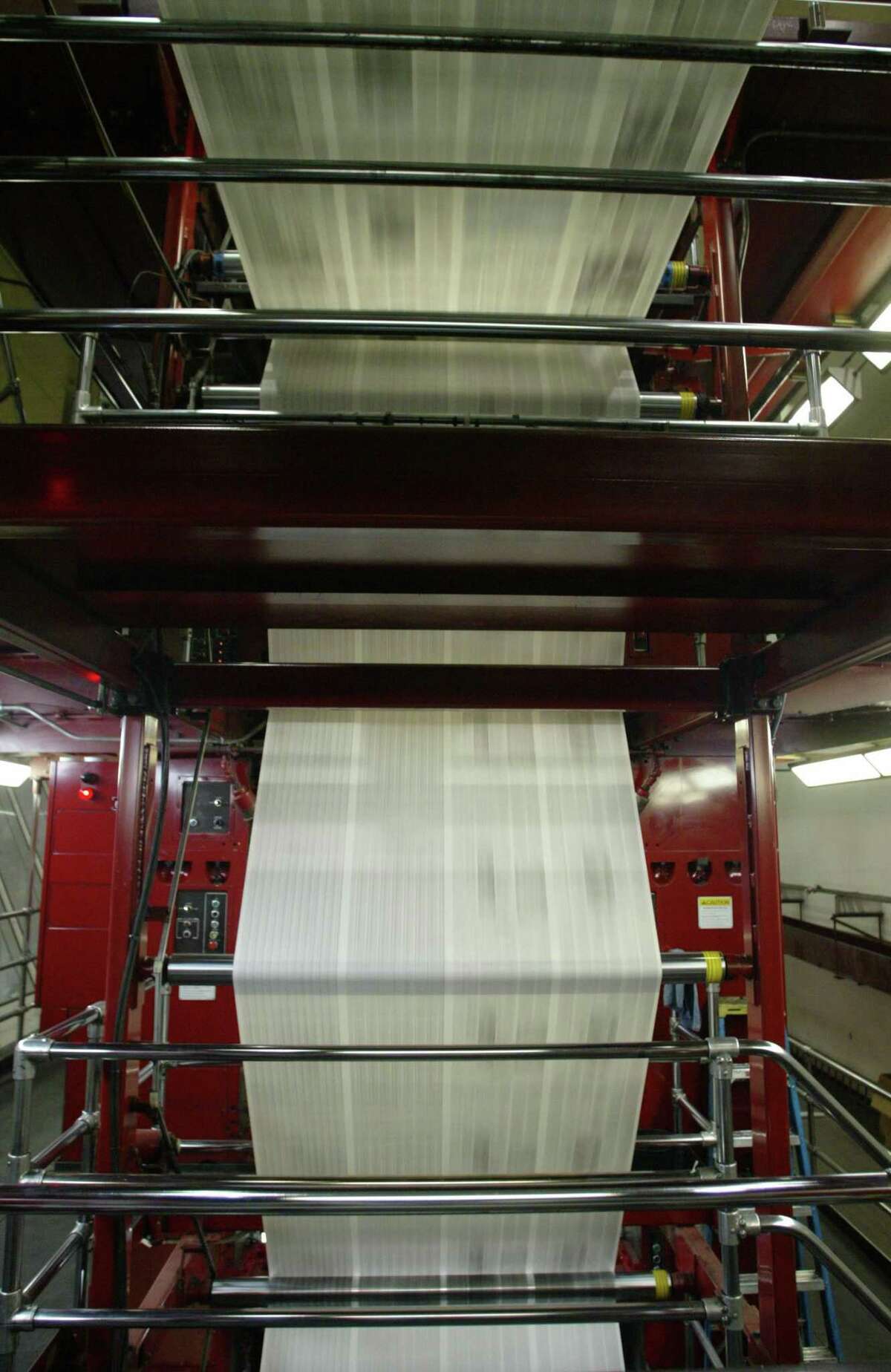 3-10-03 The Seattle Post-Intelligencer newspaper runs through a Goss press at the Times North Creek printing plant in Bothell.
