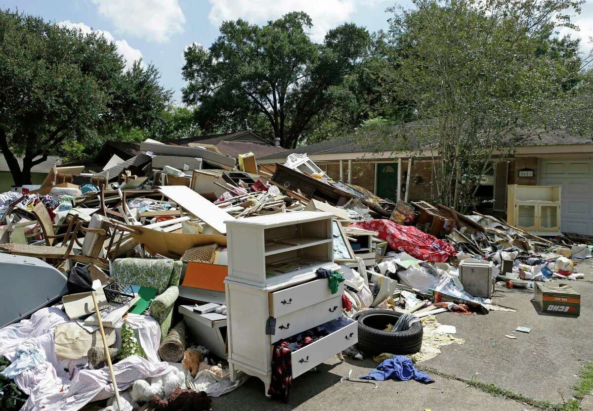 Debris outside a home on Ludington Dr. as residents clean up after Hurricane Harvey flooding in the Westbury neighborhood on Sept. 23, 2017, in Houston.
