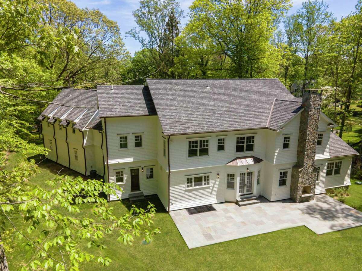 This lavish single-family home on Stony Brook Road - which offers a private back yard and has a circular drive with a cobblestone apron — sells for $2,999,999. The home — which is set up high on a hill, is one-third of a mile to the Darien train station and has lots of copper work — has a basement, main level, second level, third level and attic.  