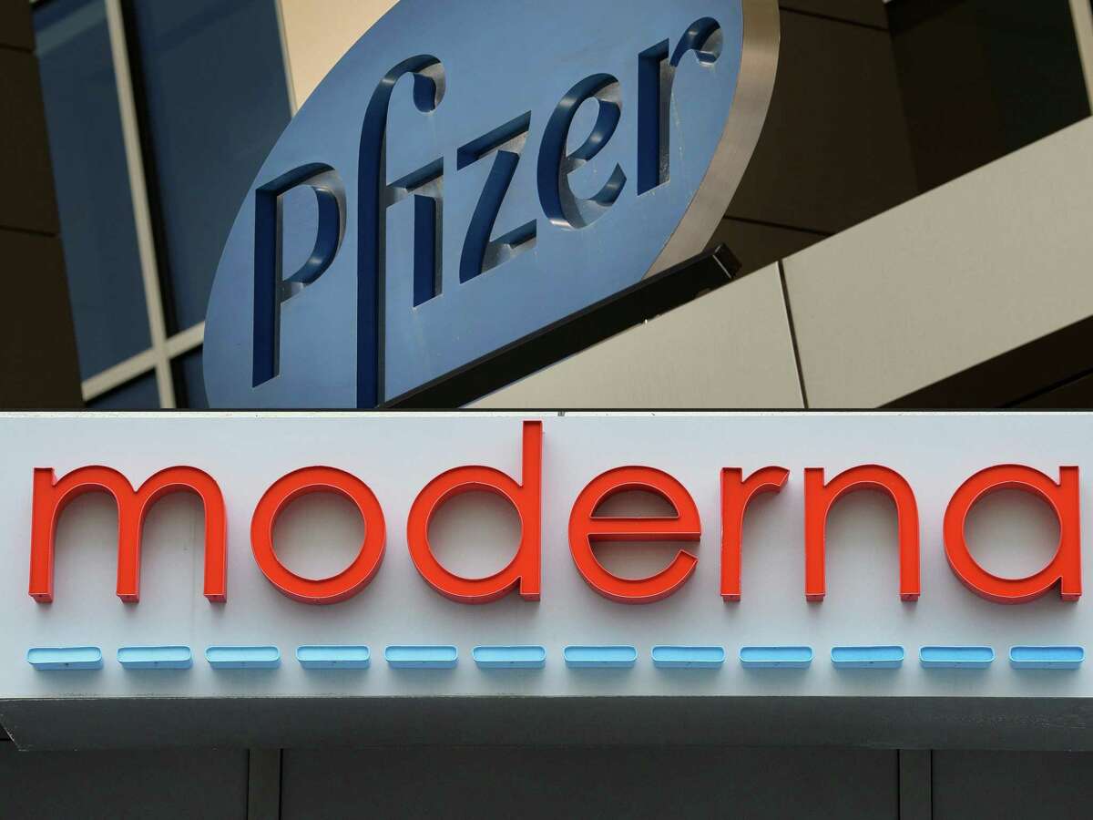 (COMBO) This combination of file pictures created on August 05, 2020 shows a sign for Pfizer pharmaceutical company in Cambridge, Massachusetts, on March 18, 2017, and the Moderna headquarters in Cambridge, Massachusetts on May 18, 2020. - Pfizer, Moderna, Novavax: executives at several American laboratories developing Covid-19 vaccines have recently pocketed millions of dollars by selling shares in their companies -- raising questions about the propriety of such a move in the midst of a national health crisis. On the very day that pharmaceutical giant Pfizer announced preliminary data showing its vaccine was 90 percent effective against the coronavirus, its chief executive Albert Bourla sold shares worth $5.6 million. (Photos by DOMINICK REUTER and Joseph Prezioso / AFP) (Photo by DOMINICK REUTER,JOSEPH PREZIOSO/AFP via Getty Images)