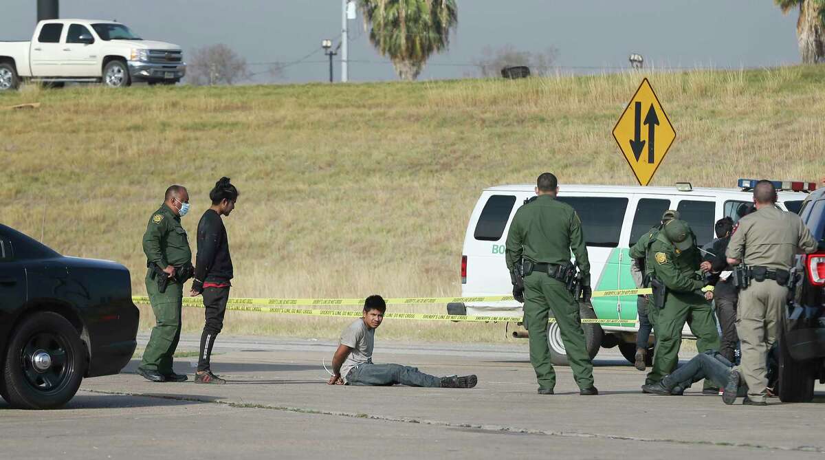 A vehicle carrying several undocumented immigrants crash after a chase by Department of Public Safety Troopers at the Texas Best Exxon at I-35 South and 1604 on Thursday, Nov. 19, 2020. The chase started around 8 a.m. when Frio County law enforcement noticed a truck carrying several males and suspected possible human trafficking. A chase ensued heading north on I-35 and DPS troopers were asked to intervene. The truck made it to a gas station with troopers pursuing it when it struck a gas pump. The driver, a male U.S. citizen was detained and taken to an area hospital with unknown injuries. Seven adult males - all undocumented - were also detained at the scene and U.S. Customs and Border Protection agents were called to process the undocumented individuals at the scene. The 26-year-old driver is charged with evading arrest, aggravated assault and human smuggling according to State Trooper Sgt. Orlando Moreno.