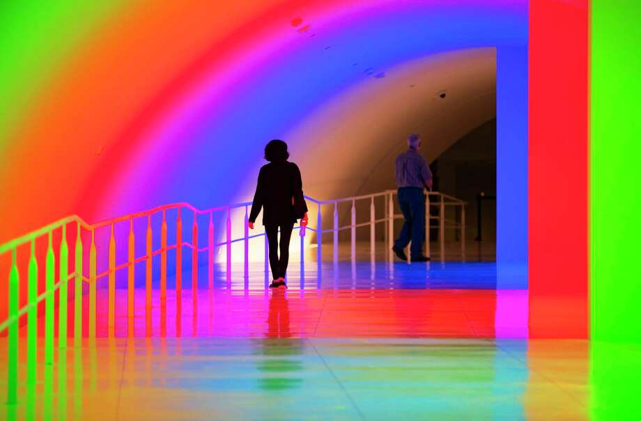 People move through Carlos Cruz-Diez's "Cromosaturación MFAH," a new tunnel connecting The Museum of Fine Arts Houston's new Nancy and Rich Kinder Building to the rest of the campus, Wednesday, Nov. 18, 2020, in Houston. Photo: Mark Mulligan Staff Photographer / © 2020 Mark Mulligan / Houston Chronicle