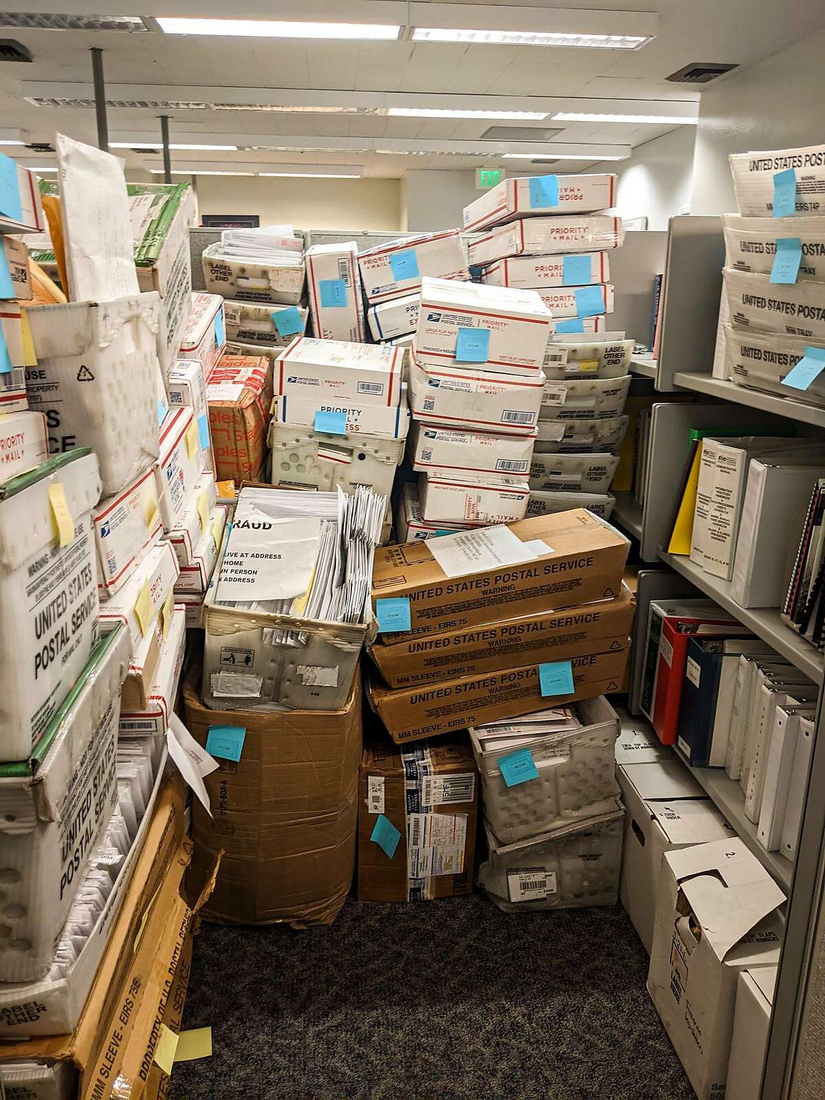 This undated photo shows a large volume of mail returned to the California Employment Development Department. The California State Auditor inspected a sample and found multiple mailings containing full Social Security numbers. In one case, an individual had written on the envelope, “this person does not live at this address” — and the envelope contained two of the three highest-volume forms we recommended EDD change, both of which displayed an individual’s full Social Security number.