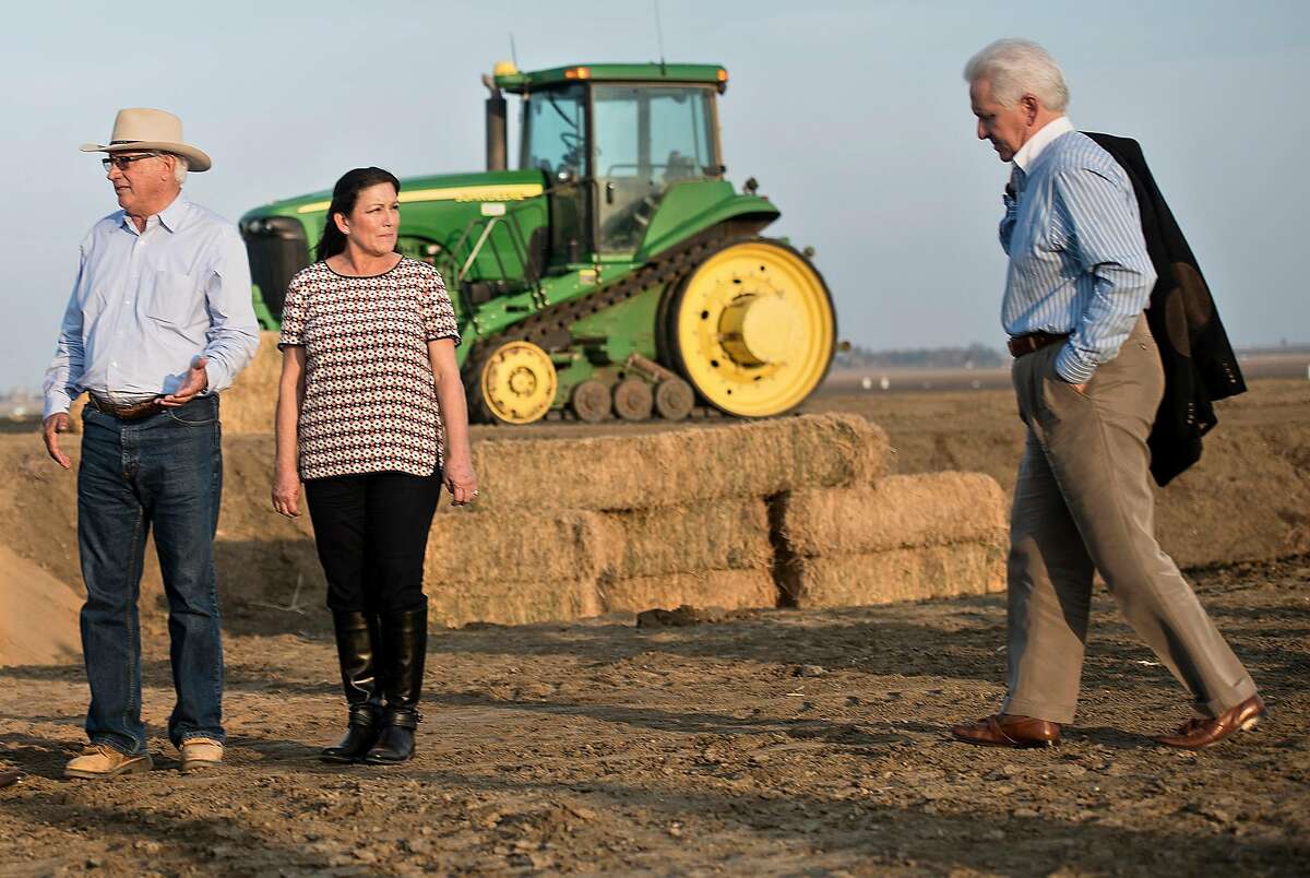 Rep. Jim Costa, D-Fresno (right), meets with Joe and Maria Gloria Del Bosque on their farm in 2014. Costa is seeking to become the chairman of the powerful House Agriculture Committee.
