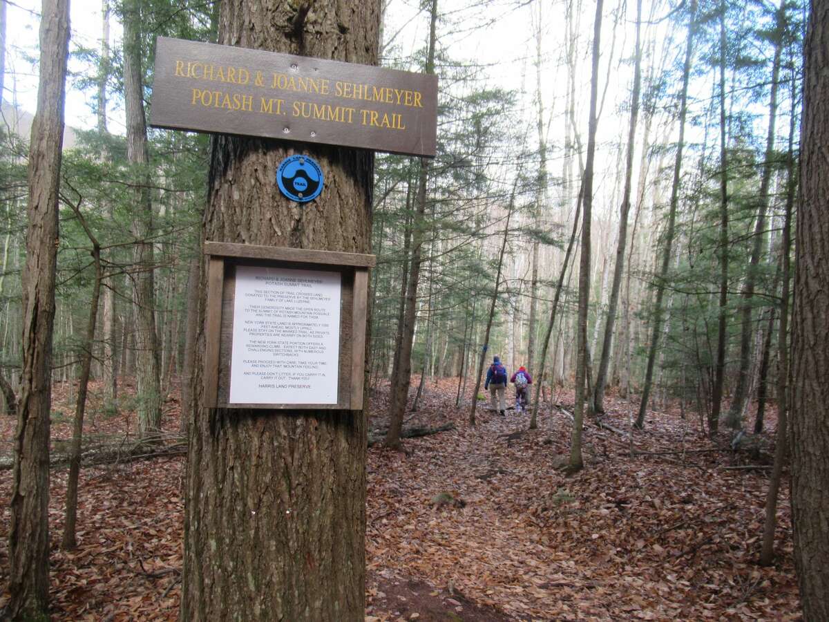 A sign on Potash Mountain marks the area where local landowners donated land for a trail to connect the Harris Land Preserve to state land on the mountain's summit. (Herb Terns / Times Union)