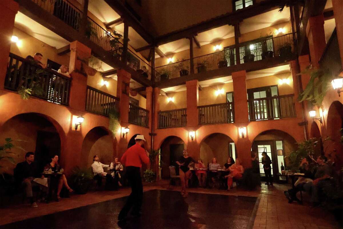 Guests at the Hotel Valencia Riverwalk enjoy a weekend Tengo performance by Luisa Vasquez and Julio Ossorio Torres in the courtyard on Saturday, Oct. 17, 2020.
