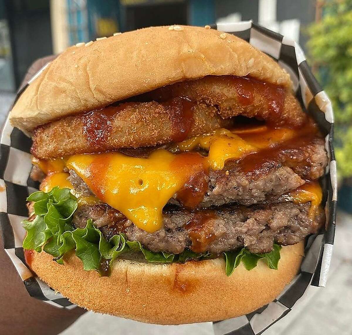 The Ghost Town Burger from Malibu's Burger is a vegan take on a classic western, with onion rings, barbecue sauce and American cheese.