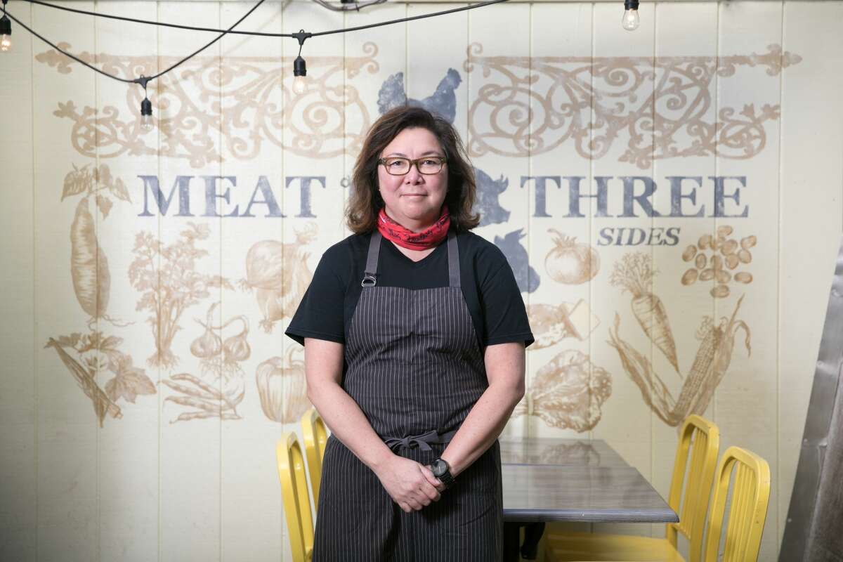 Owner Brenda Buenviaje stands on the outdoor back patio open to customers at Brenda's Meat and Three on Divisadero Street in San Francisco on Nov. 19, 2020. Like many other restaurants, Brenda's has been severely affected by the COVID-19 coronavirus pandemic.