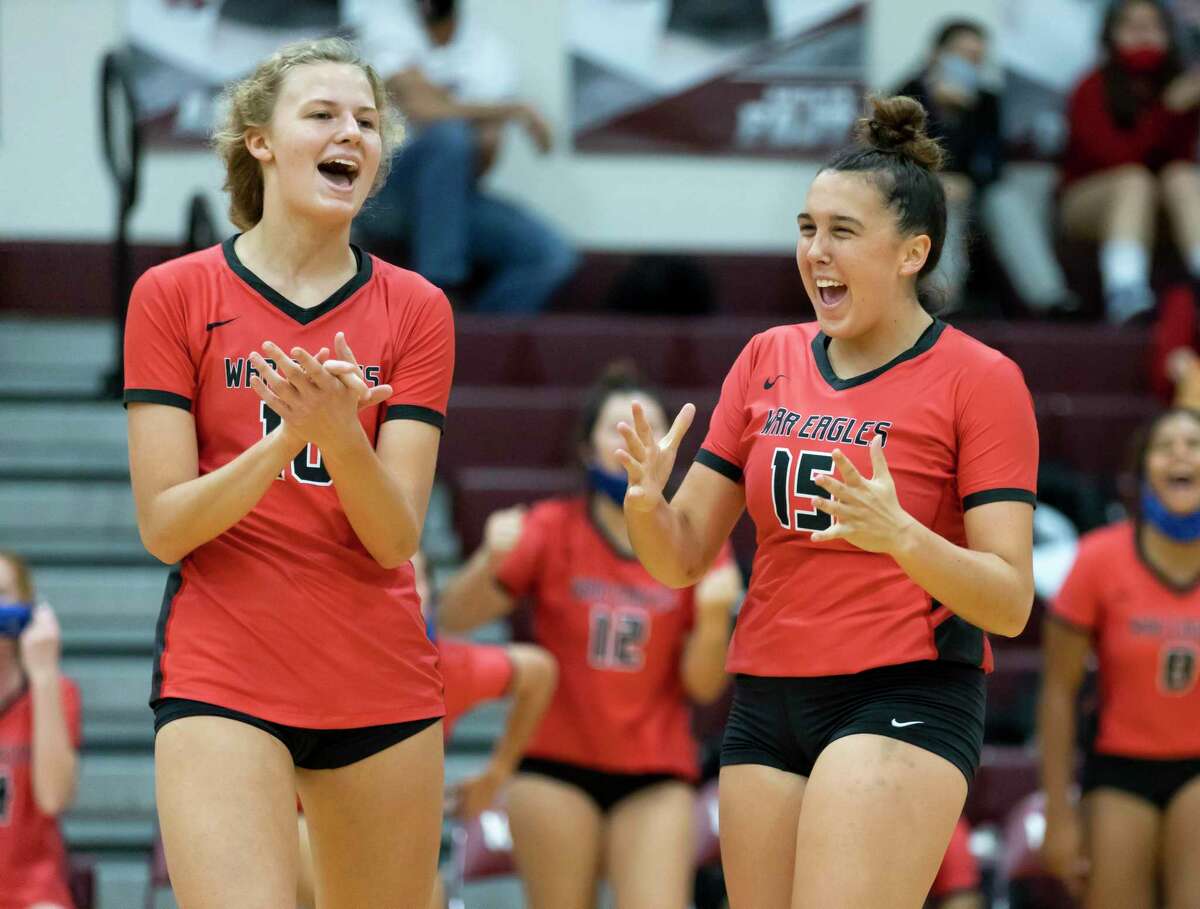 FILE PHOTO — Oak Ridge right side hitter Tory Perduk (10) and setter Piper Boydstun (15) react after winning the fourth set of a non-district volleyball match at Magnolia High School, Saturday, Sept. 19, 2020.