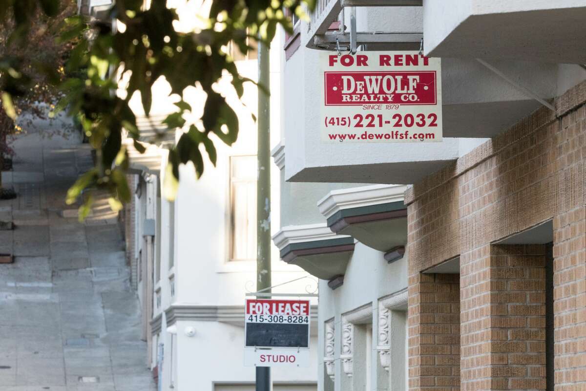 A "for rent" sign hangs outside an apartment building in San Francisco on Nov. 19, 2020.