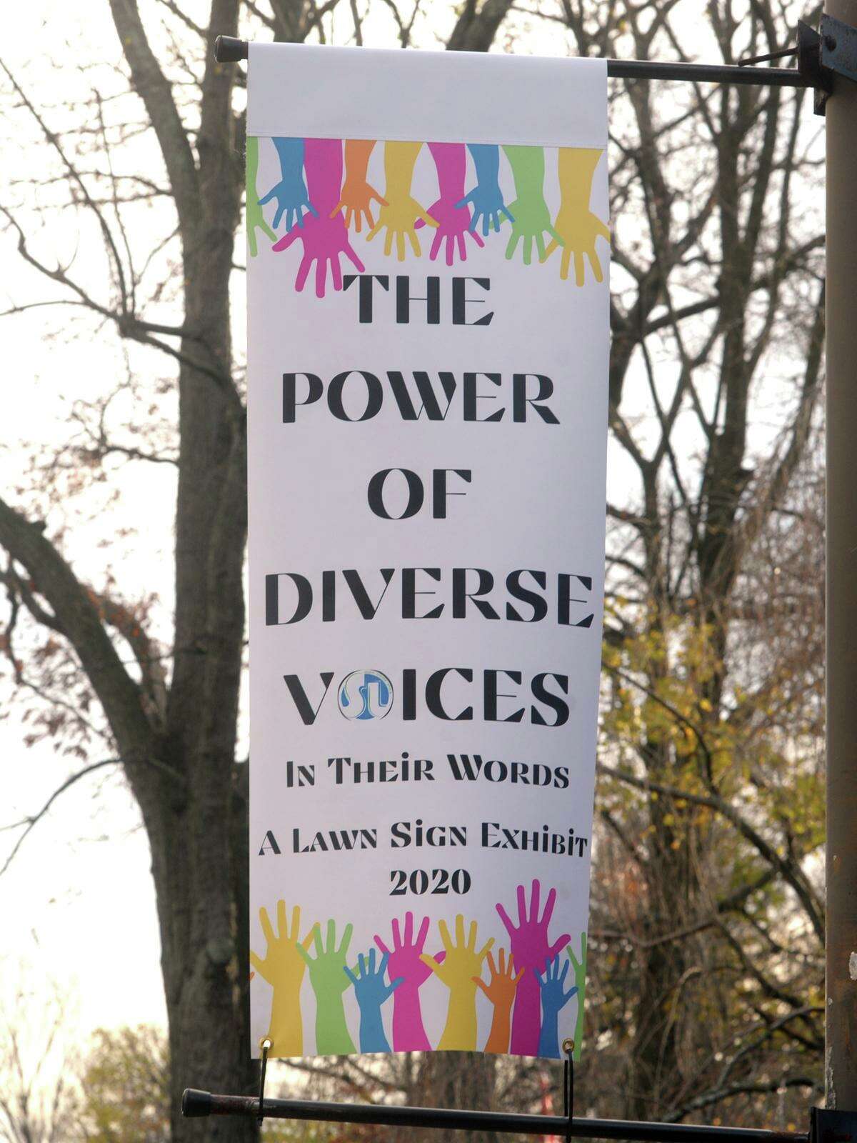 A banner promoting the Power of Diverse Voices lawn signs currently on display of the Stratford Library, in Stratford, Conn. Nov. 19, 2020. A ribbon-cutting Monday was attended by Mayor Laura Hoydick, Police Chief Joseph McNeil and Library Board members Robyn Proto, Joel Pleban, Peg Sheahan, Janice Cupee and Gladys A. Ramos. The project is the first of several dealing with racism and implicit bias planned by the library in conjunction with the town, CARE (Citizens Addressing Racial Equity), Sterling House Community Center, the Council of Churches, Rotary Club of Stratford and the Arts Alliance of Stratford. Szymanski said several groups were working on their own anti-racism objectives independently before learning of each other’s work and collaborating.