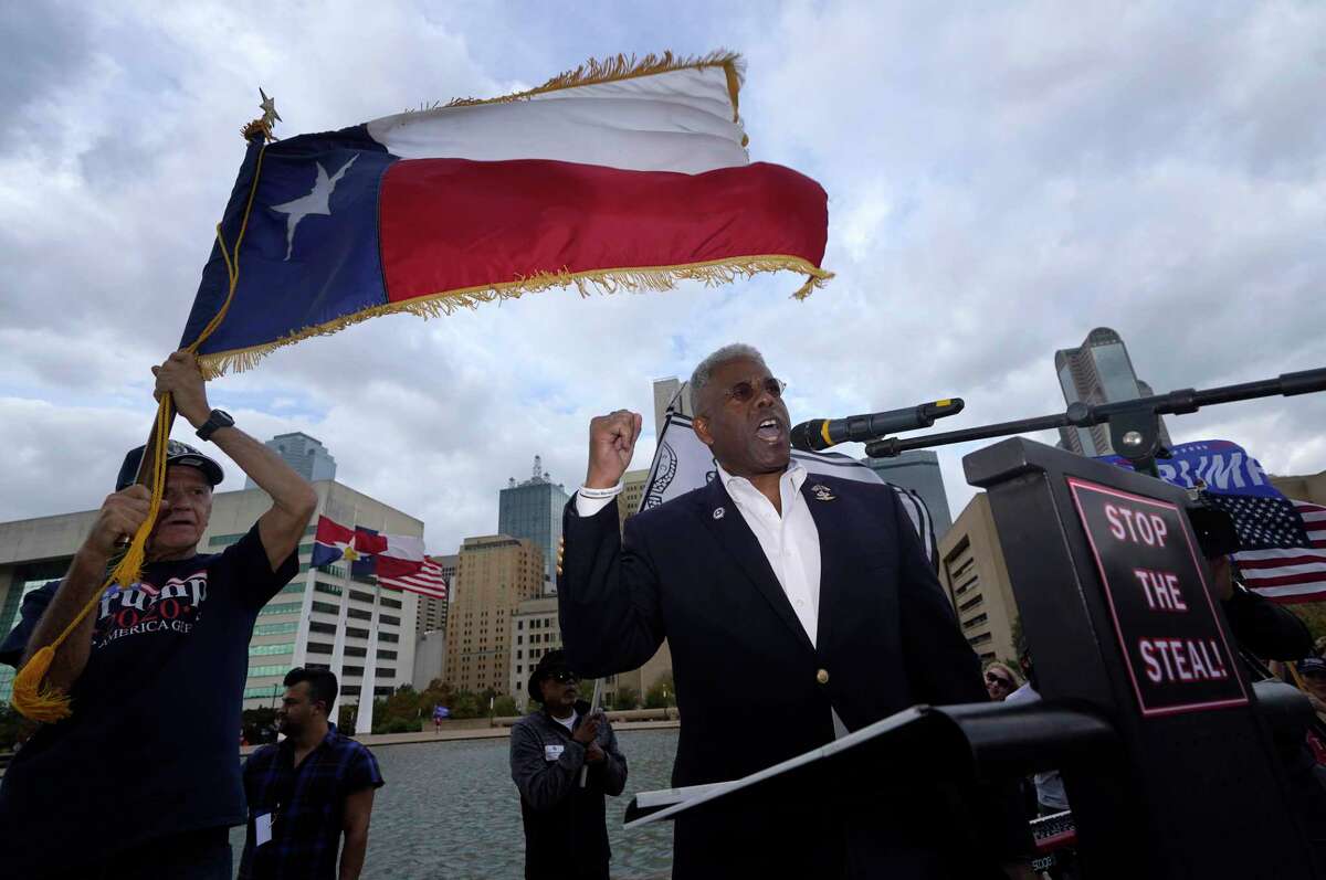 Texas GOP chairman Allen West, right, speaks to supporters of former President Donald Trump during a rally in front of City Hall in Dallas, Saturday, Nov. 14, 2020. Texas GOP put out a statement shortly after President Joe Biden's inauguration continuing to allege that "massive election irregularities" contributed to Trump's loss. (AP Photo/LM Otero)