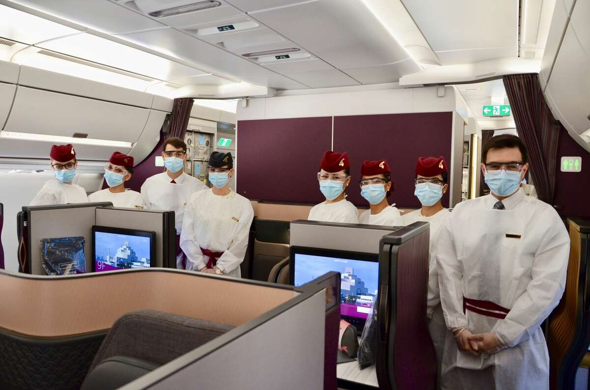 Mandatory masks hide the bright smiles from these Qatar Airways cabin crew members, but it's all part of the commitment the airline said it has to health and safety while on board. SEE THE SLIDESHOW at the top of this post for an in-depth look!