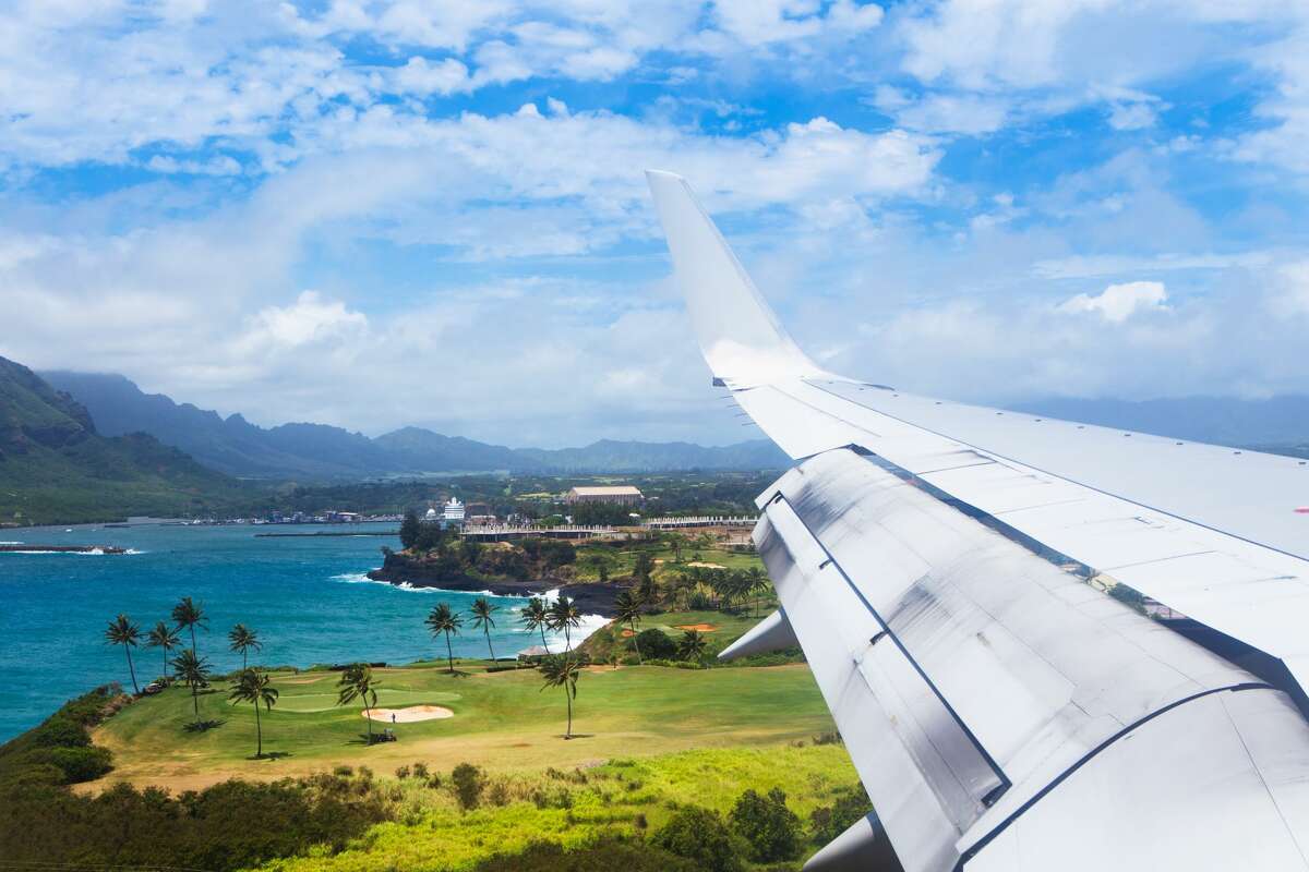 A plane flies to Lihue Airport on Kauai.