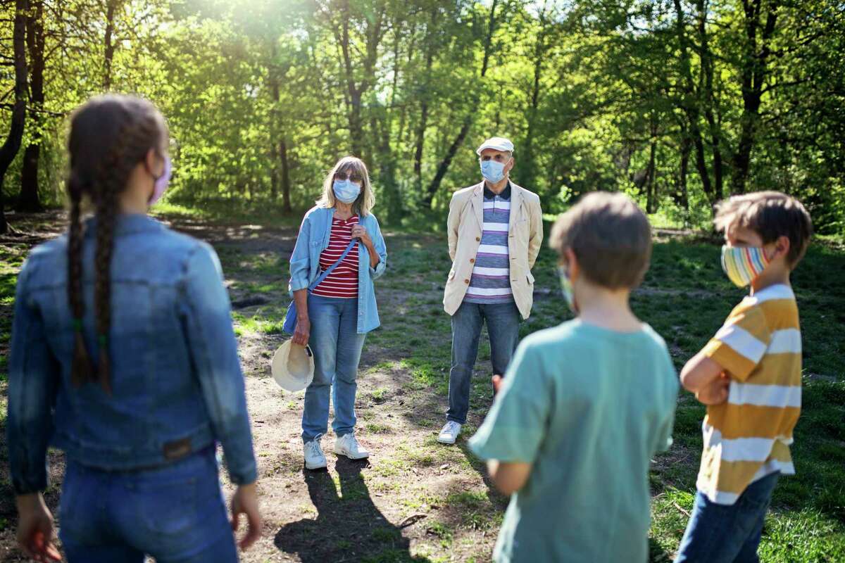 During the pandemic, experts urge people to wear masks, keep their distance, and meet outdoors.
