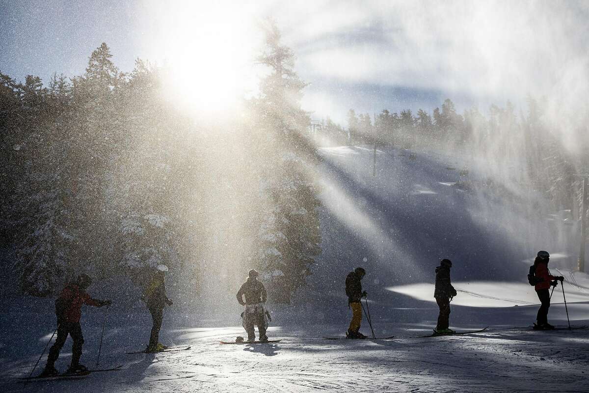 Skiers and snowboarders wait in line for the lift during opening day at Heavenly Mountain Resort in South Lake Tahoe, California, November 20, 2020.