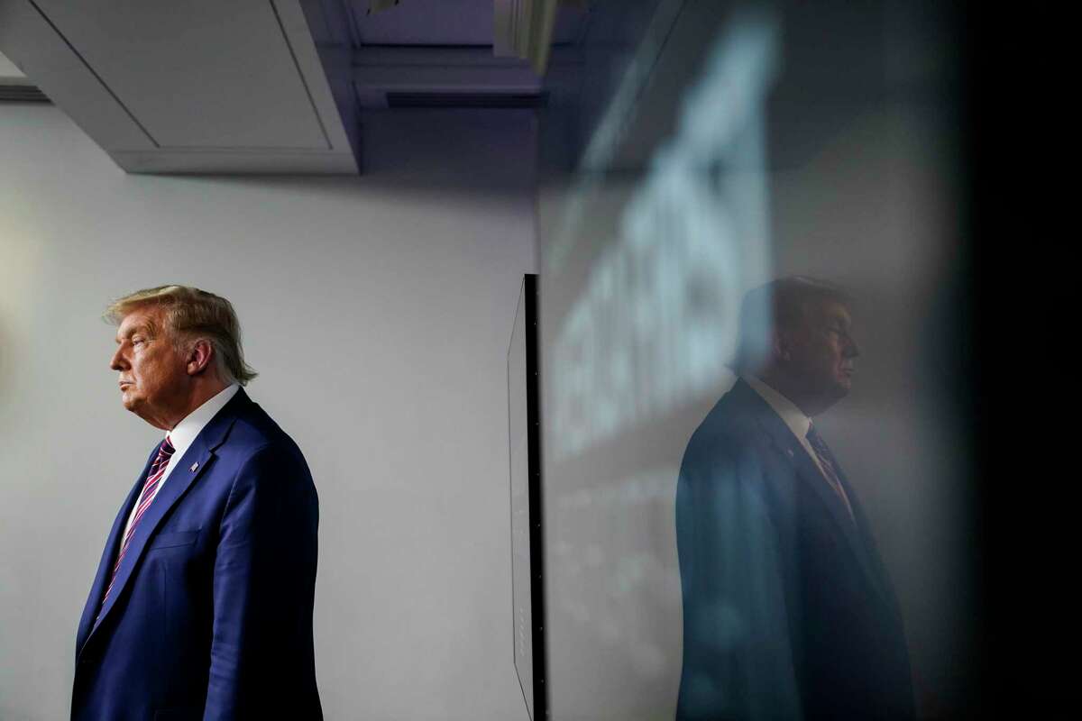 President Trump stands in the James S. Brady Press Briefing Room of the White House on Friday.