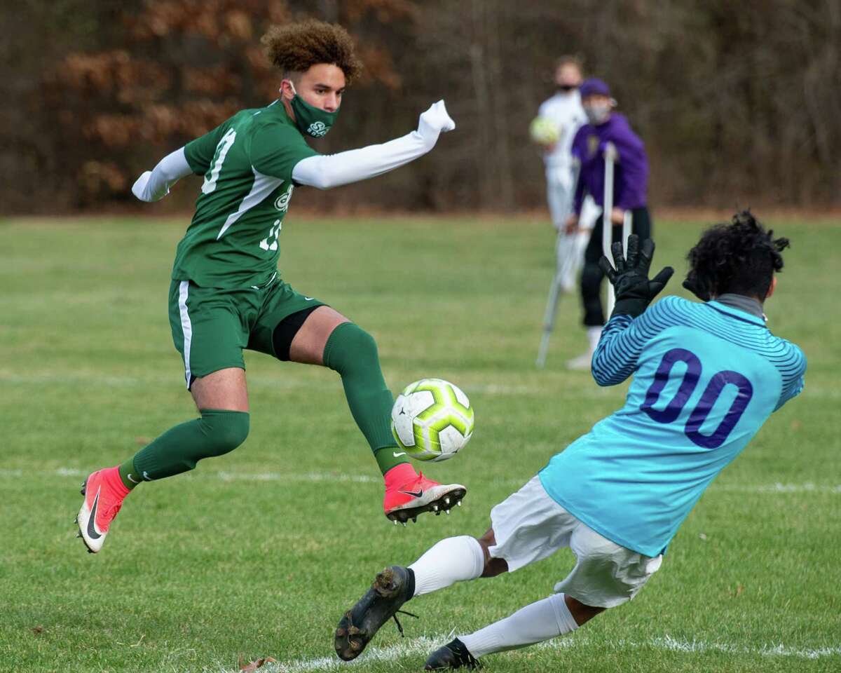 Shenendehowa senior Darien Espinal beats CBA keeper Adrian Torres for a goal during the Suburban Council championship at Shenendehowa High School in Clifton Park, NY, on Saturday, Nov. 21, 2020 (Jim Franco/special to the Times Union.)