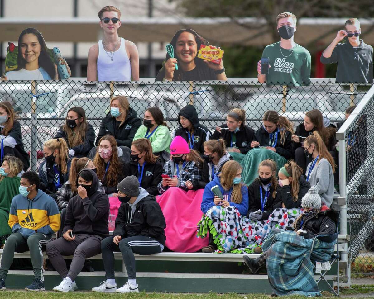The Shenendehowa girls soccer team watches the boys play in the Suburban Council championship against CBA at Shenendehowa High School in Clifton Park, NY, on Saturday, Nov. 21, 2020, after their championship game against Shaker High School was canceled because of COVID-19 (Jim Franco/special to the Times Union.)