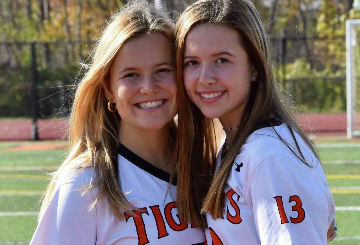 In their final game together, sisters Riley (left) and Mackenzie Peters scored goals to help the Ridgefield field hockey team win its first postseason title.