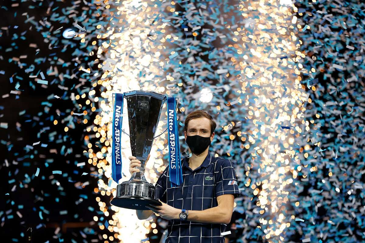LONDON, ENGLAND - NOVEMBER 22: Daniil Medvedev of Russia lifts the trophy after winning his singles final match against Dominic Thiem of Austria during day eight of the Nitto ATP World Tour Finals at The O2 Arena on November 22, 2020 in London, England. (Photo by Clive Brunskill/Getty Images)