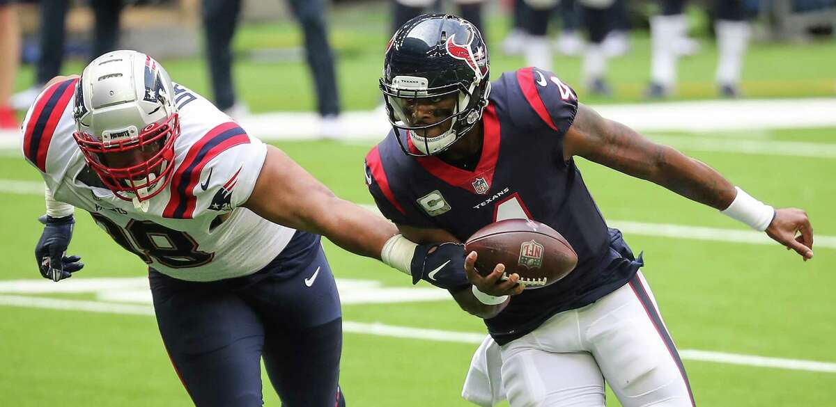 Deshaun Watson runs past Patriots defensive tackle Carl Davis for a 4-yard touchdown run to spark Houston’s win over New England.