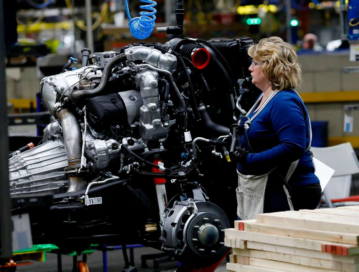 An assembly worker at General Motors pickup truck in Flint, Mich. The automaker has switched sides in supporting California’s attempt to preserve its right to set vehicle emissions standards.