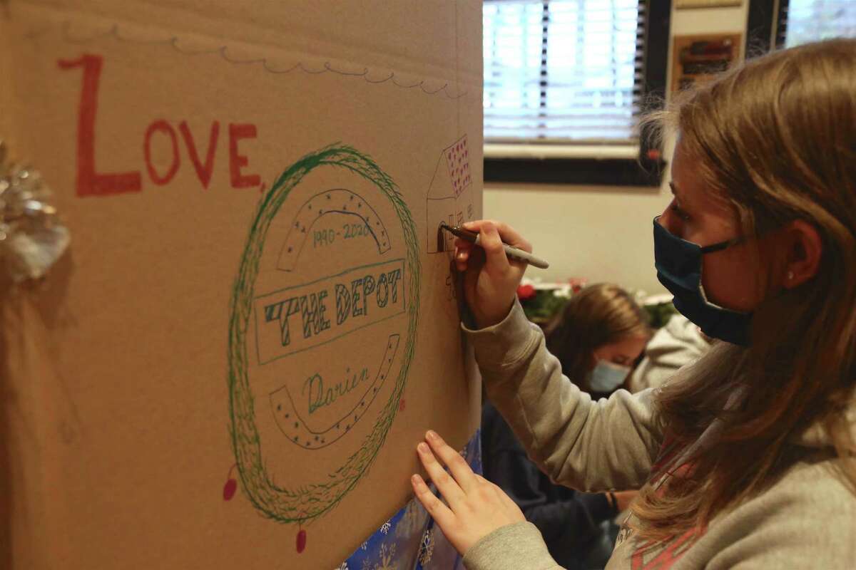 Kids prepare the boxes at The Darien Depot on Saturday, Nov. 21, 2020, for the upcoming clothing drive, which kicks off on Nov. 30.