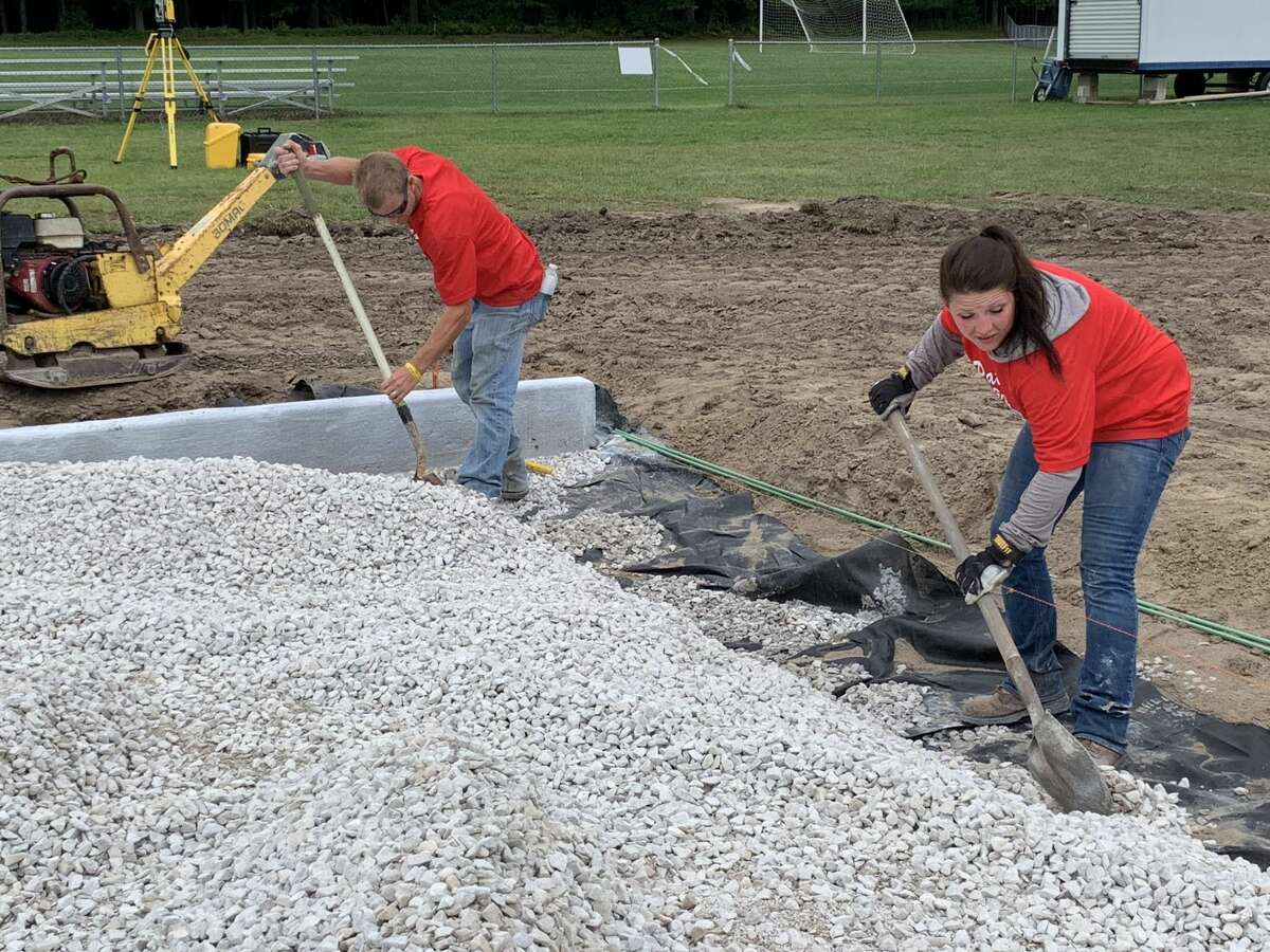Work crews undergo excavation for Dow High's new turf field on Sept. 2, 2020.