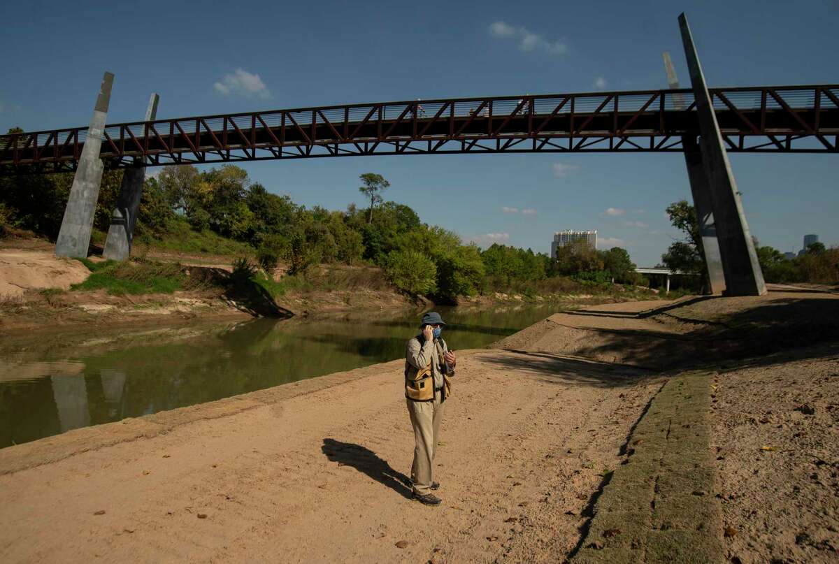 Tom Douglas, with the Bayou Preservation Association, looks at a canoe launch point on Buffalo Bayou near the Lost Lake Visitor Center on Friday, Nov. 6, 2020, in Houston.