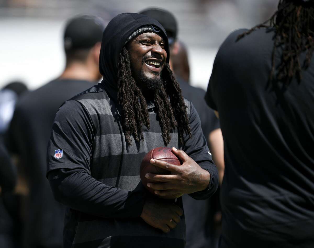 Oakland Raiders running back Marshawn Lynch stands on the sidelines during the first half in an NFL preseason football game against the Los Angeles Rams on Saturday, Aug. 18, 2018, in Los Angeles.