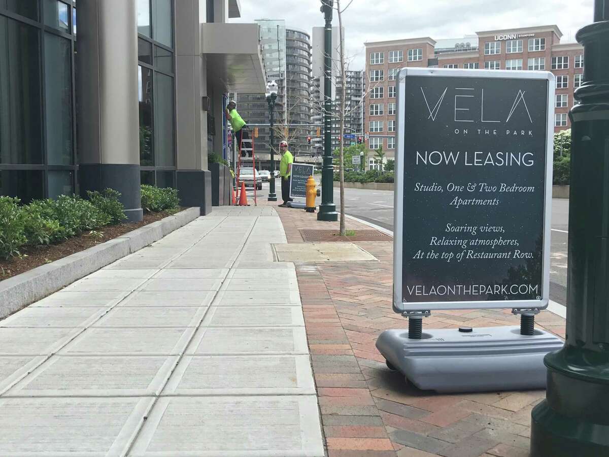 Signs advertising luxury rental apartments in the newly constructed Vela on the Park building on Washington Boulevard on June 15, 2018. Apartment occupancy in Stamford is about 97 percent, according to officials, fueling economic changes in the city.