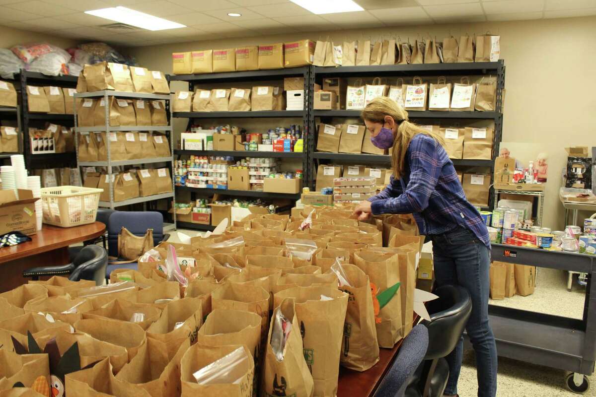 This year, Meals on Wheels Montgomery County will be delivering 692 meal bags to clients on Thanksgiving. Tania Shulkin, a regular volunteer at Meals on Wheels, fills the Thanksgiving bags with non-perishable items on Nov. 24, 2020.
