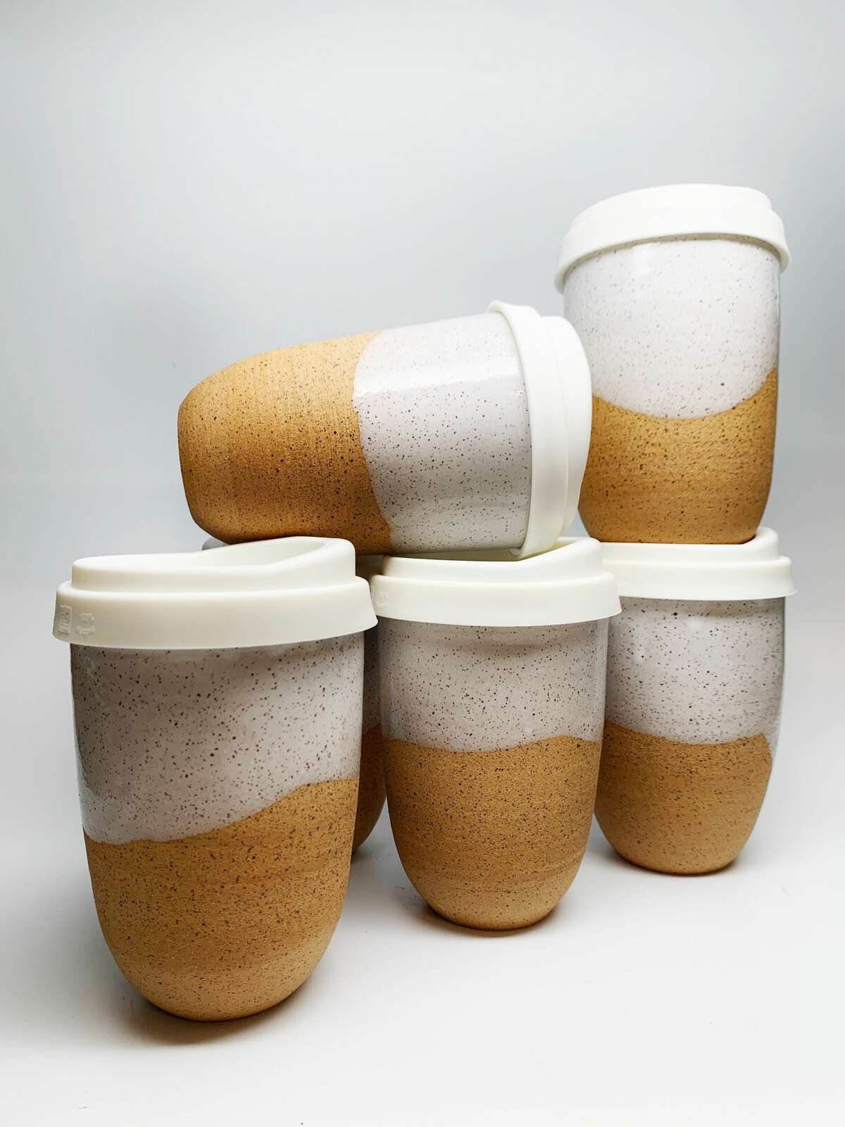 Milk & Honey swirl travel mugs from Rockwater Pottery in Ridgefield. Rockwater Pottery, Ridgefield  Products: Pottery Rockwater Pottery takes its inspiration from the landscape and classic farmhouses of New England where owner/artist Jaclyn Frances grew up. Her pottery is designed to easily blend into a variety of contemporary and classic homes by utilizing a neutral color palette and classic forms. Their rustic tones evoke a natural look but also remind the user of milk paint, hand hewn beams and wide plank floors of vintage barns. rockwaterpottery.com